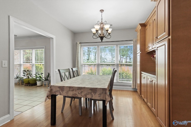 208 Honor Way, Madison, AL 35758 - dining space with a chandelier, light wood-style flooring, and baseboards