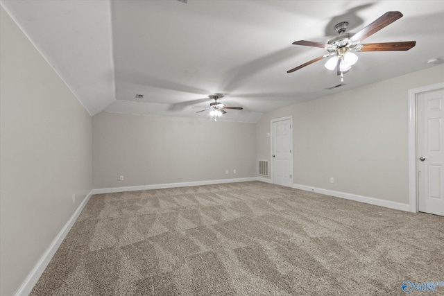 208 Honor Way, Madison, AL 35758 - spare room featuring light colored carpet, ceiling fan, baseboards, and vaulted ceiling