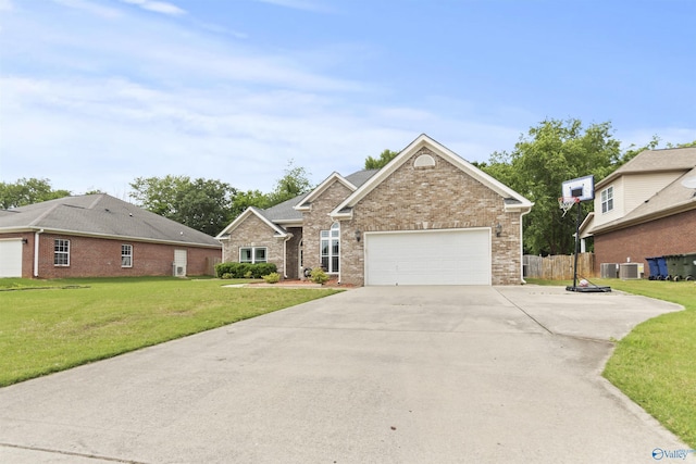 208 Honor Way, Madison, AL 35758 - view of front of house with driveway, an attached garage, brick siding, and central air condition unit