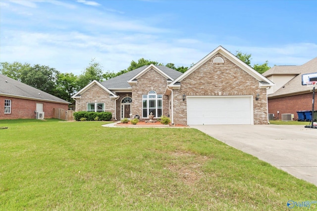 208 Honor Way, Madison, AL 35758 - view of front of property featuring driveway, a front lawn, a garage, brick siding, and cooling unit