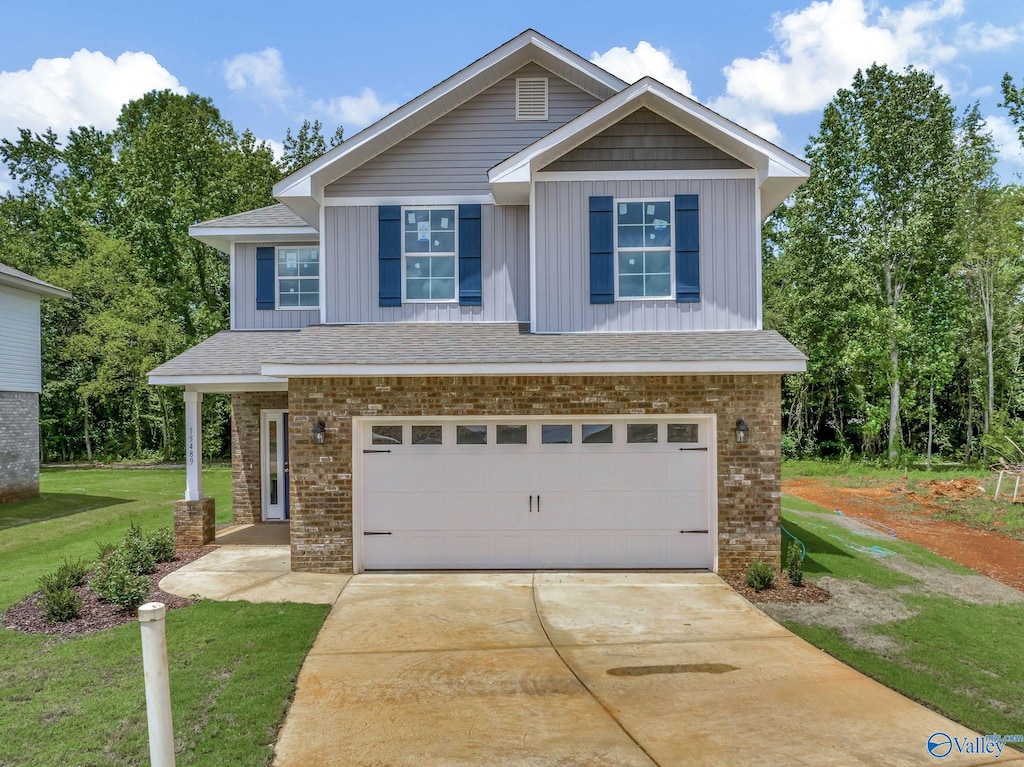 craftsman-style home with a garage and a front yard