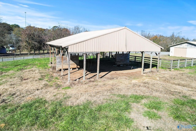 view of outdoor structure with a rural view