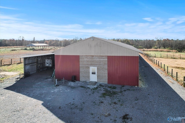 view of outbuilding with a rural view