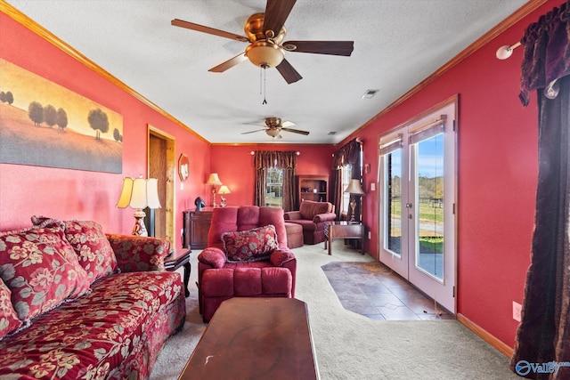 living room with light carpet, a textured ceiling, ceiling fan, and crown molding