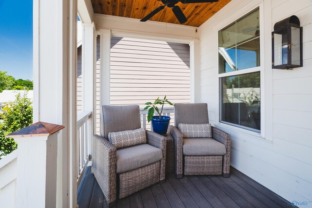 wooden deck featuring ceiling fan