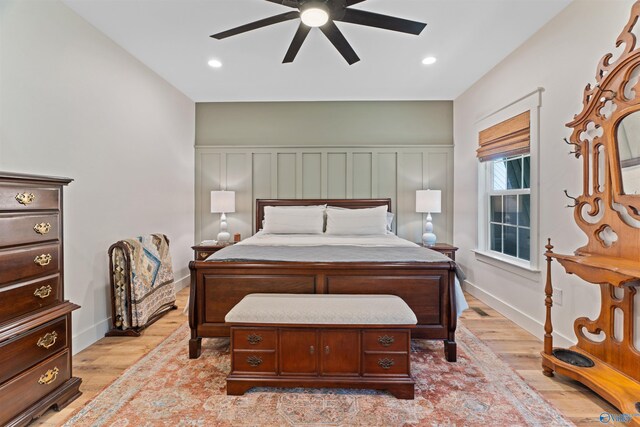 bedroom with light wood-type flooring and ceiling fan