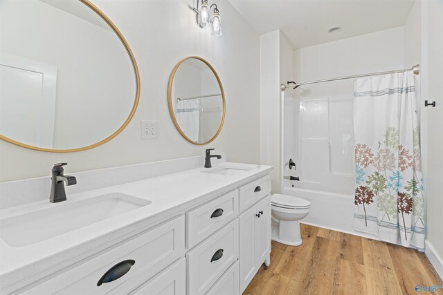 full bathroom featuring shower / tub combo with curtain, toilet, double sink vanity, and hardwood / wood-style floors