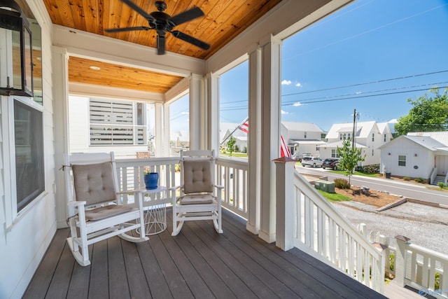 deck featuring a residential view and ceiling fan
