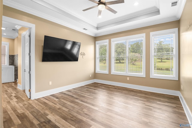 unfurnished living room with visible vents, crown molding, wood finished floors, and ceiling fan