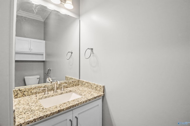 half bath featuring toilet and vanity