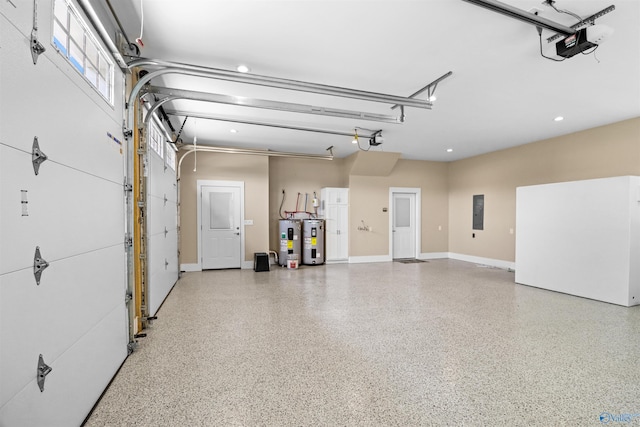 garage featuring recessed lighting, a garage door opener, and electric water heater