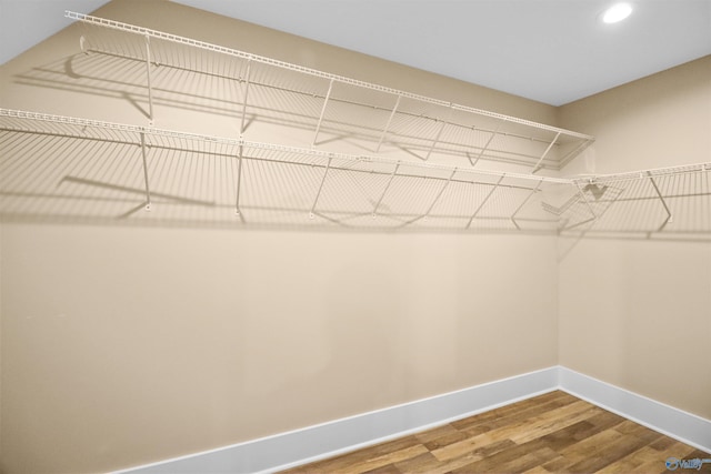 spacious closet with wood finished floors