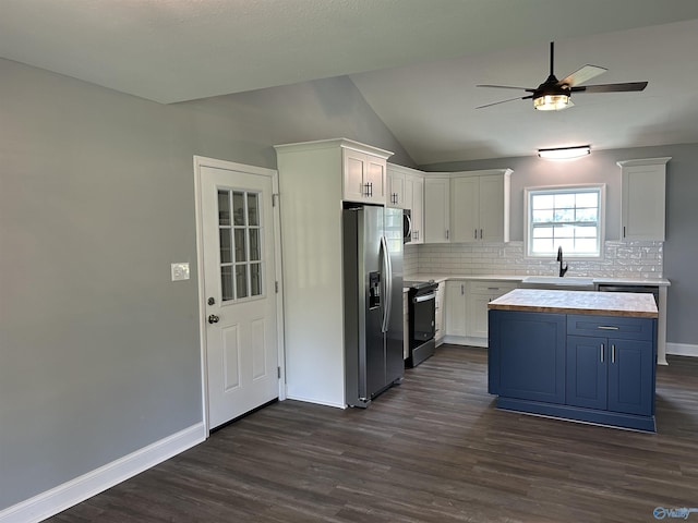 kitchen with a sink, white cabinetry, light countertops, appliances with stainless steel finishes, and dark wood finished floors