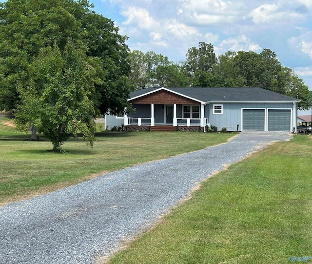 ranch-style house with a garage, a front yard, covered porch, and gravel driveway