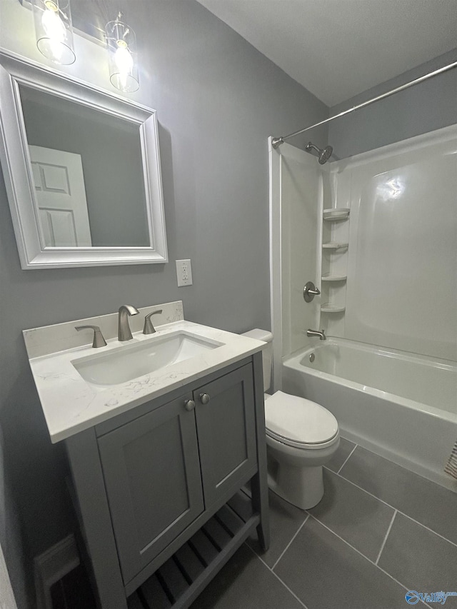 bathroom featuring toilet, shower / tub combination, vanity, and tile patterned floors