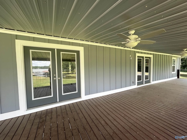 wooden deck with a ceiling fan and french doors