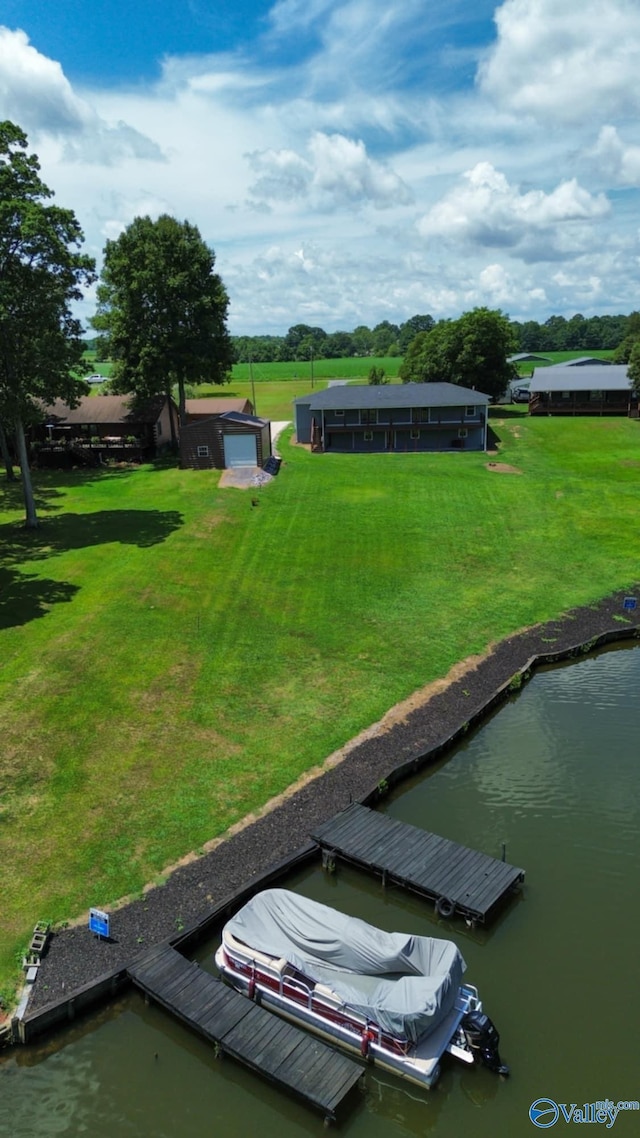 exterior space with a boat dock and a water view