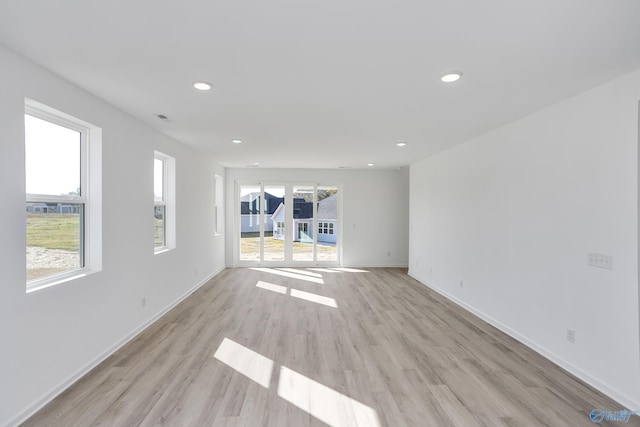 spare room with light wood-type flooring