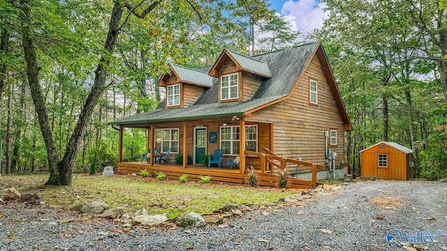 log cabin featuring a shed