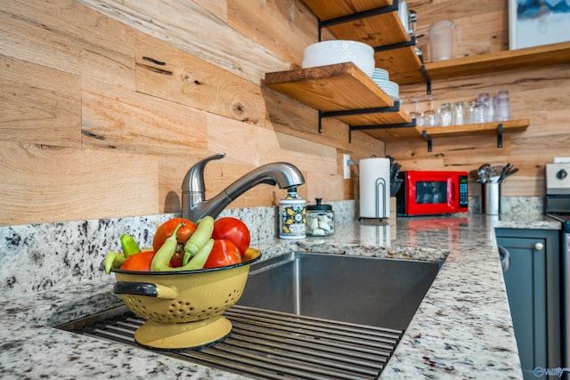 interior details featuring wood walls and sink