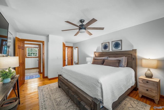 bedroom featuring light hardwood / wood-style floors and ceiling fan