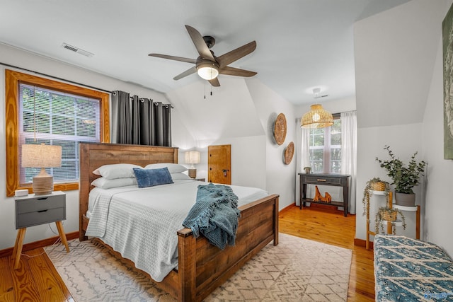 348 Rd 1951, Mentone, AL 35984 - bedroom with light wood-style flooring, vaulted ceiling, baseboards, and a ceiling fan