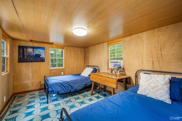 bedroom with wooden walls and wooden ceiling