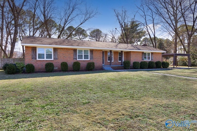 single story home featuring a carport and a front lawn