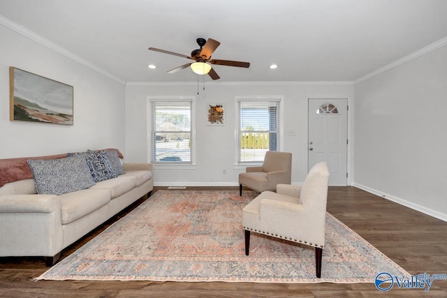 living room with crown molding, ceiling fan, and dark hardwood / wood-style flooring