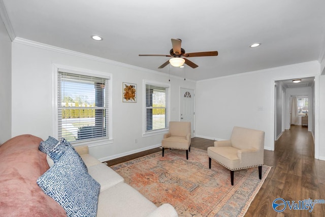 living room featuring crown molding, ceiling fan, and dark hardwood / wood-style floors