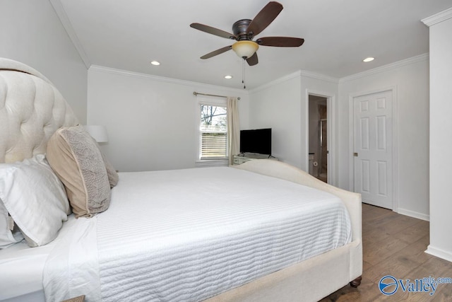 bedroom with dark wood-type flooring, ornamental molding, and ceiling fan