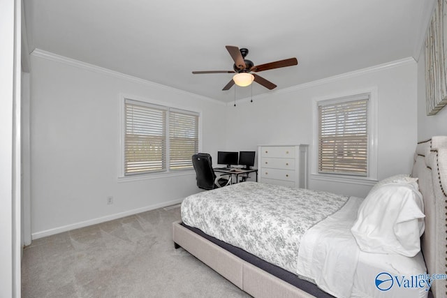 carpeted bedroom with crown molding and ceiling fan