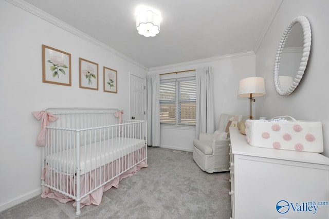 carpeted bedroom featuring a nursery area and ornamental molding