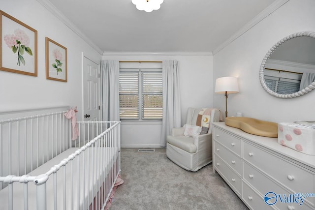 bedroom featuring a crib, ornamental molding, and light colored carpet