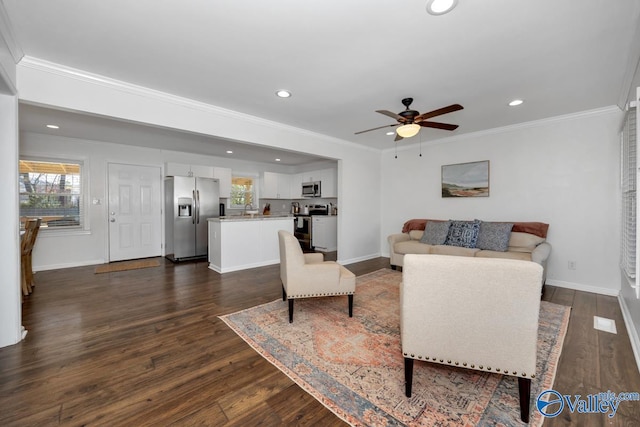 living room with crown molding, ceiling fan, and dark hardwood / wood-style flooring