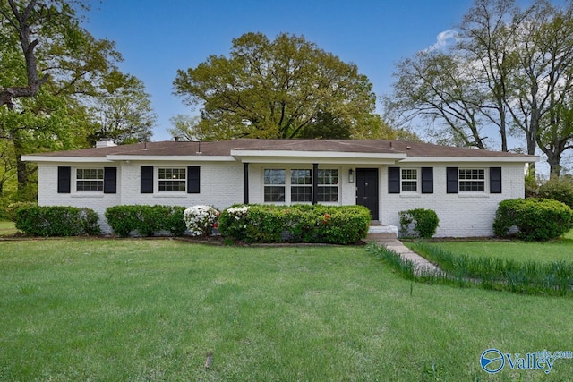 4407 Sparkman Dr NW, Huntsville, AL 35810 - ranch-style home featuring a chimney, a front yard, and brick siding