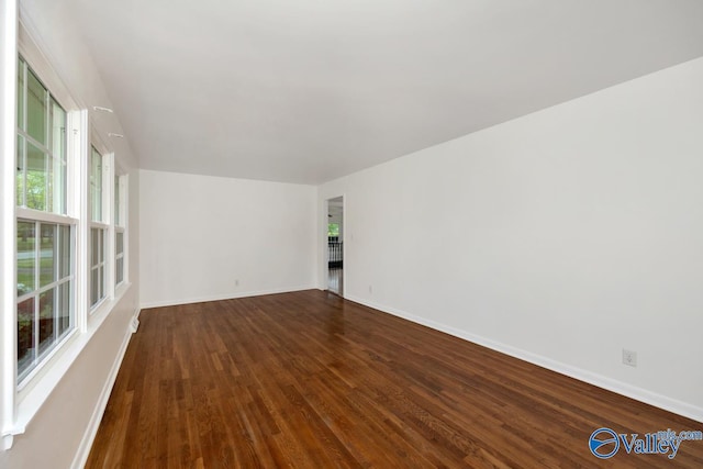 4407 Sparkman Dr NW, Huntsville, AL 35810 - empty room featuring dark wood-type flooring and baseboards