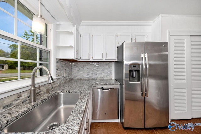 4407 Sparkman Dr NW, Huntsville, AL 35810 - kitchen featuring open shelves, light stone counters, a sink, stainless steel appliances, and backsplash