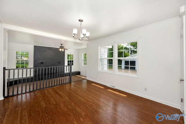 4407 Sparkman Dr NW, Huntsville, AL 35810 - living room featuring wood finished floors, baseboards, visible vents, and a healthy amount of sunlight