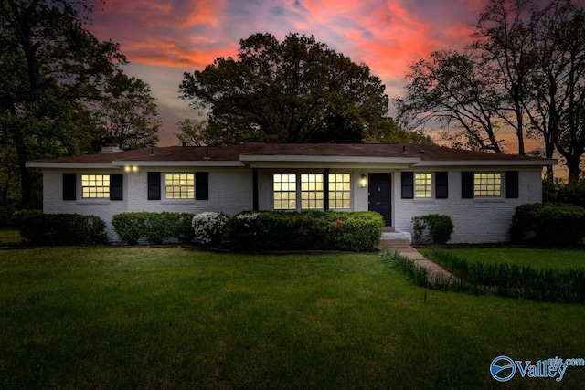 4407 Sparkman Dr NW, Huntsville, AL 35810 - ranch-style house featuring brick siding, a front lawn, and a chimney