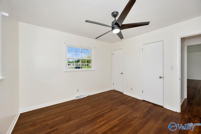 4407 Sparkman Dr NW, Huntsville, AL 35810 - unfurnished bedroom with visible vents, baseboards, a ceiling fan, and wood finished floors