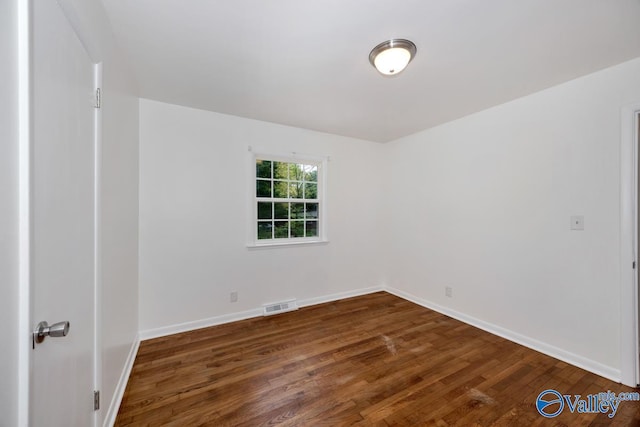 4407 Sparkman Dr NW, Huntsville, AL 35810 - empty room with baseboards, dark wood-style floors, and visible vents