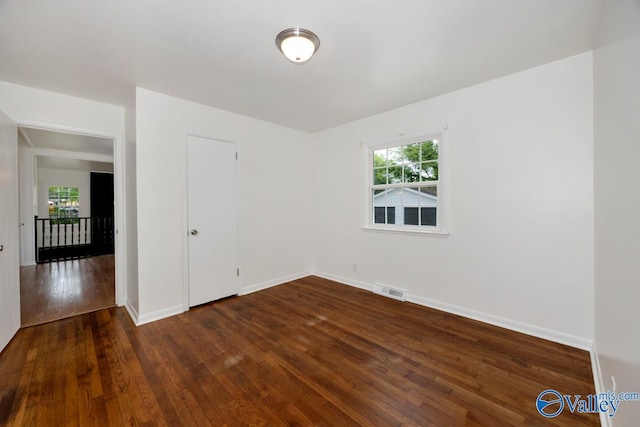 4407 Sparkman Dr NW, Huntsville, AL 35810 - spare room with dark wood-type flooring, visible vents, and baseboards