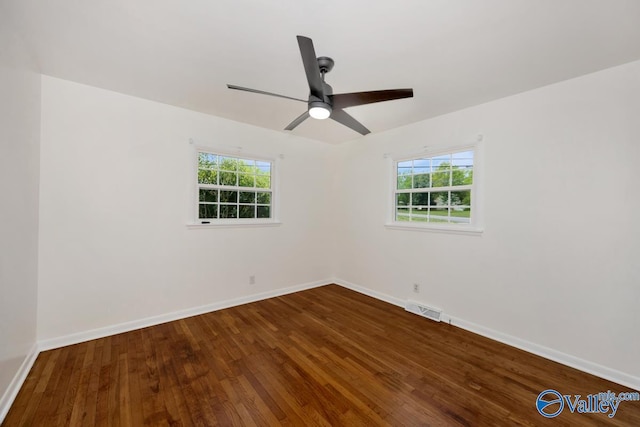 4407 Sparkman Dr NW, Huntsville, AL 35810 - spare room featuring ceiling fan, visible vents, baseboards, and dark wood finished floors