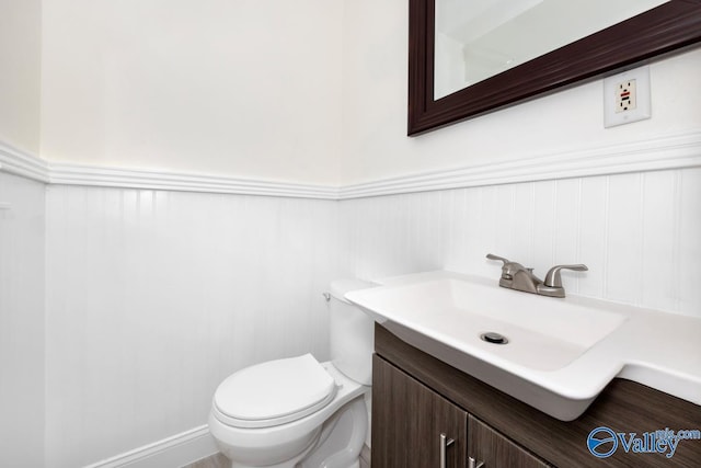 4407 Sparkman Dr NW, Huntsville, AL 35810 - bathroom featuring vanity, wainscoting, and toilet