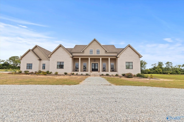 view of front facade with a porch and a front lawn