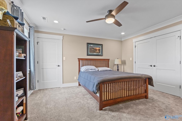 bedroom featuring light carpet, a closet, and ceiling fan