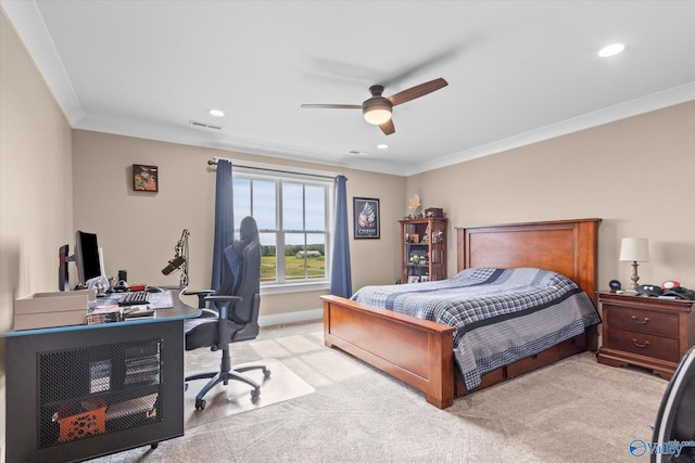 bedroom with crown molding, light carpet, and ceiling fan