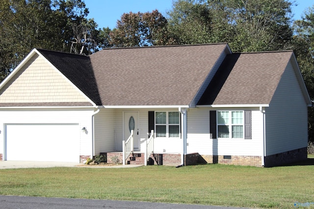 view of front of home featuring a garage and a front lawn