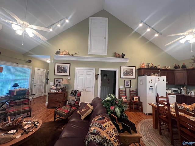 living room with rail lighting, ceiling fan, and wood-type flooring